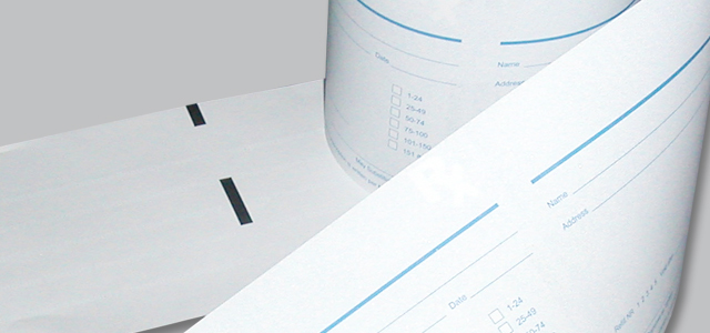 Close-up of a roll of paper with printed text and lines on a white background